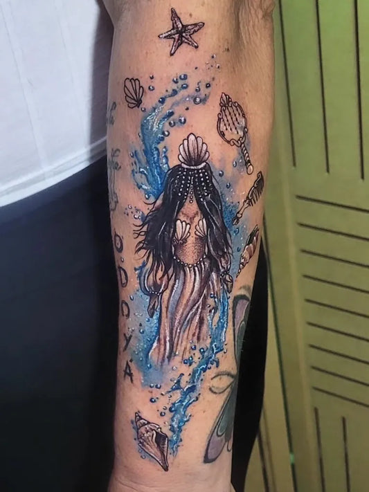 Medium Watercolor Mermaid and Seashells Tattoo on Women Arm by @2studiotattoo_f.galiote