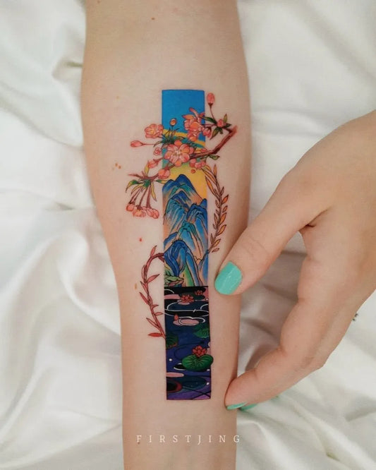 Medium Watercolor Mountain Cherry Blossom Lily Pad Tattoo on Women Arm by @inkgarden