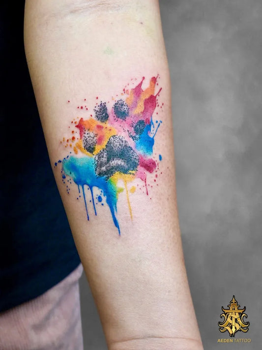 Medium Watercolor Paw Print Tattoo on Women Arm by @aedentattoost