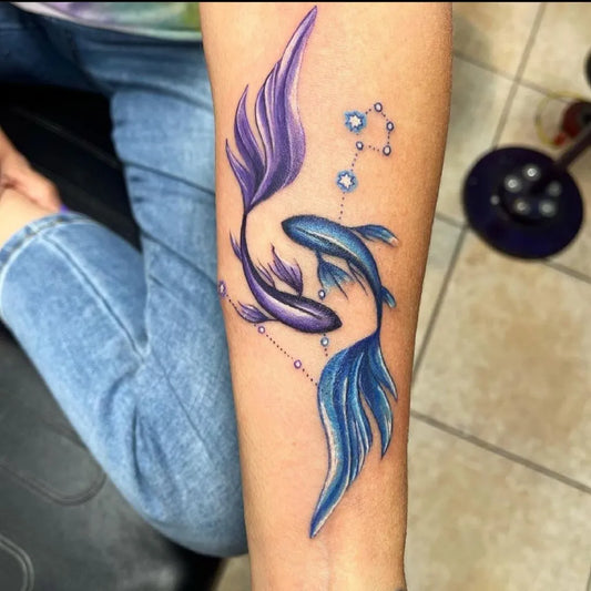 Medium Watercolor Pisces Fish Tattoo on Women Arm by @southofheaventattoo