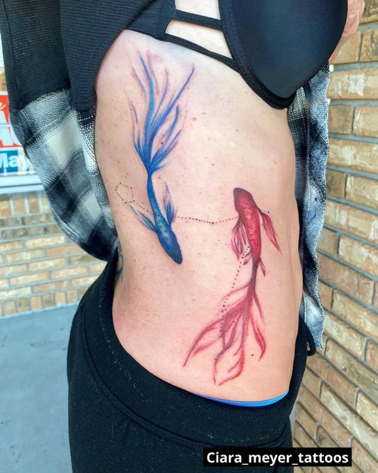 Medium Watercolor Pisces Koi Fish Tattoo on Women Ribcage by @ciara_meyer_tattoos