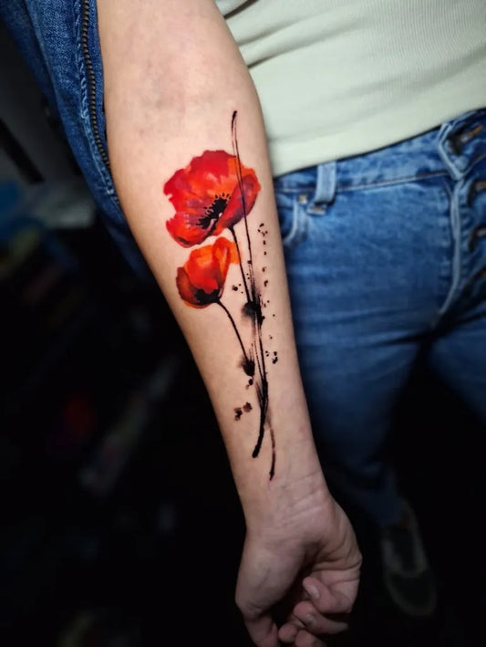 Medium Watercolor Poppy Flowers Tattoo on Women Arm by @atelier.penumbre