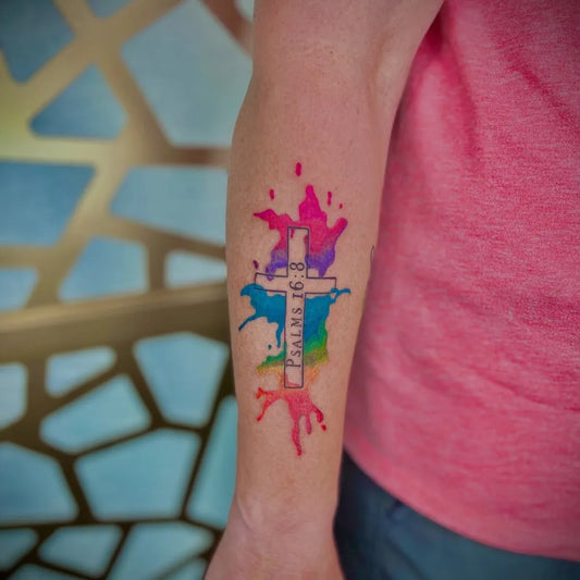 Medium Watercolor Rainbow Cross on Women Arm Tattoo by @_brie_johnson