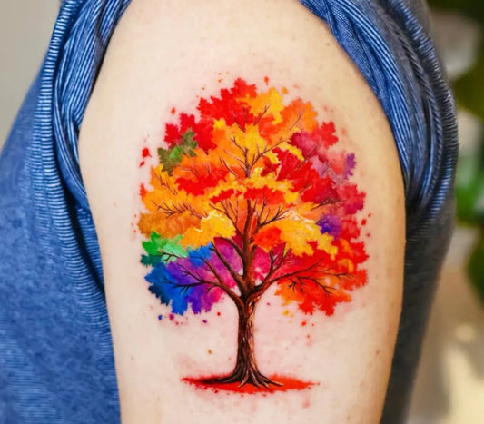 Medium Watercolor Rainbow Tree Tattoo on Women Upper Arm by @flow_tattoo_toronto