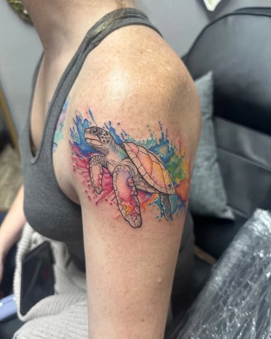 Medium Watercolor Sea Turtle Tattoo on Women Shoulder by @inkedbybethlargofl