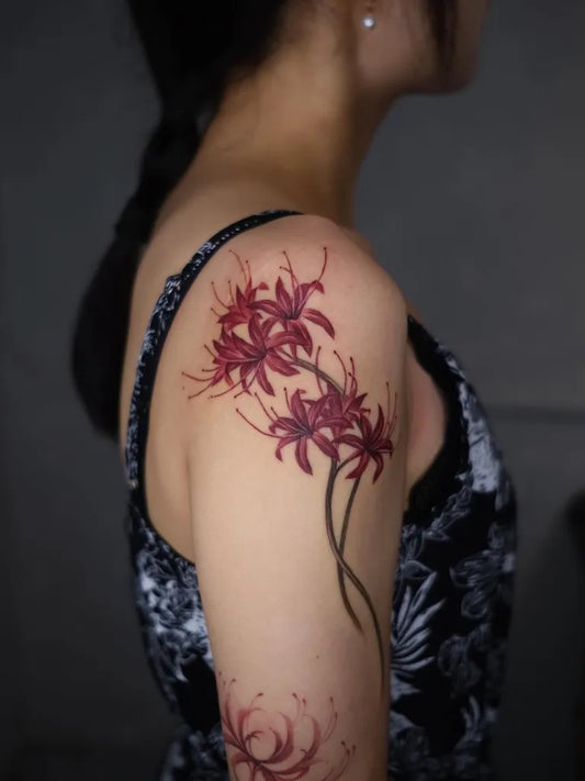 Medium Watercolor Spider Lily red Tattoo on Women Shoulder by @___soil