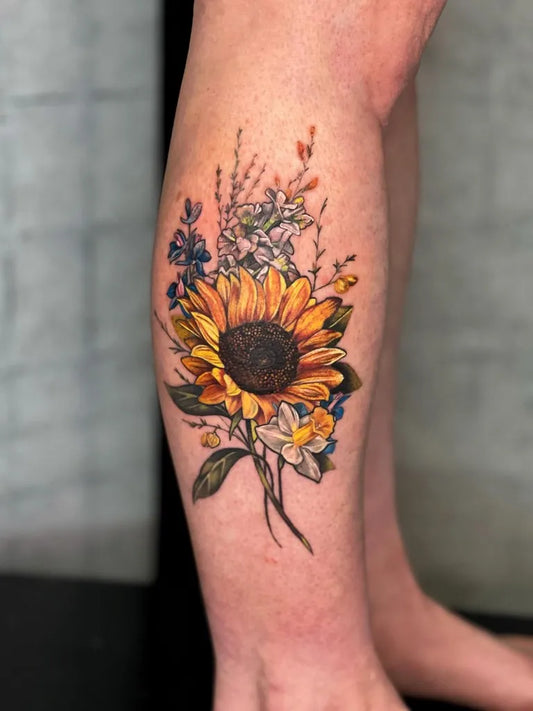 Medium Watercolor Sunflower Flowers on Women Calf Tattoo by @skoll_tattoo