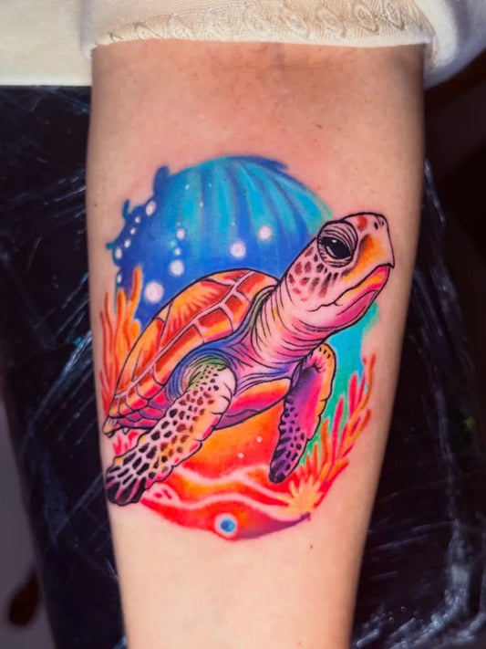 Medium Watercolor Turtle and Coral Tattoo on Women Arm by @aakash_tattoos