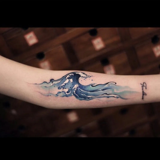 Medium Watercolor Wave Tattoo on Women Arm by @tattooful