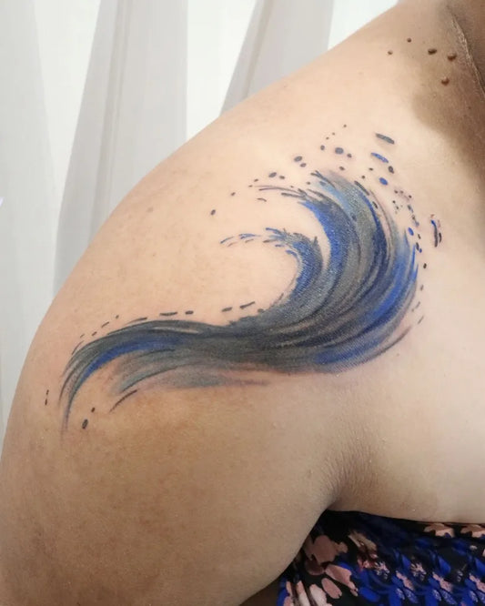Medium Watercolor Wave Tattoo on Women Shoulder by @aroha_tattoo