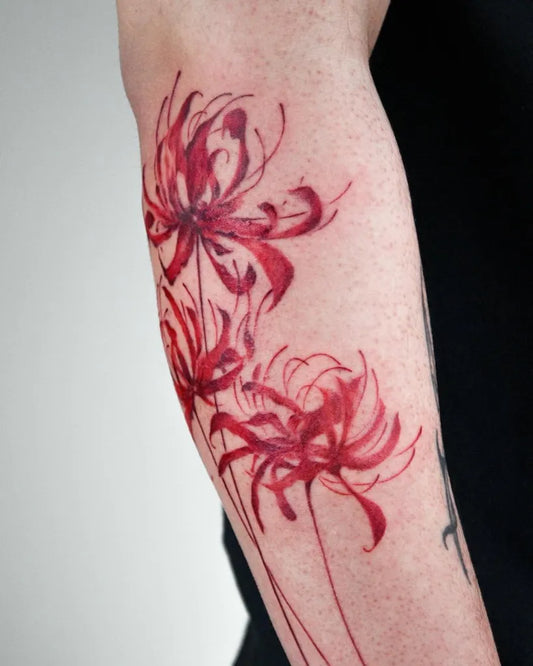 Medium Watercolor red Spider Lily Tattoo on Women Arm by @wasabi.cjtattoo