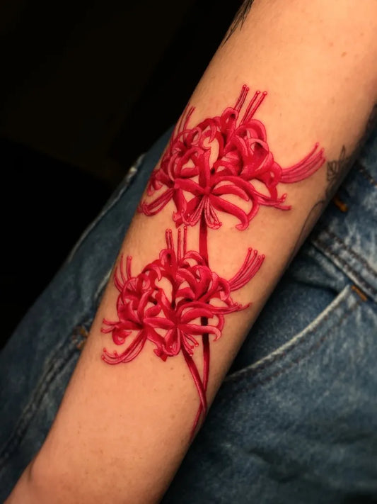 Medium Watercolor red spider lily tattoo on women arm by @maytattoos