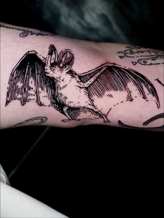 Medium Woodcut Bat Tattoo on Men Arm by @tillwest.ttt