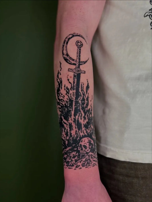 Medium Woodcut CrescentMoonSwordSkull Tattoo on Men Arm by @tapiotats