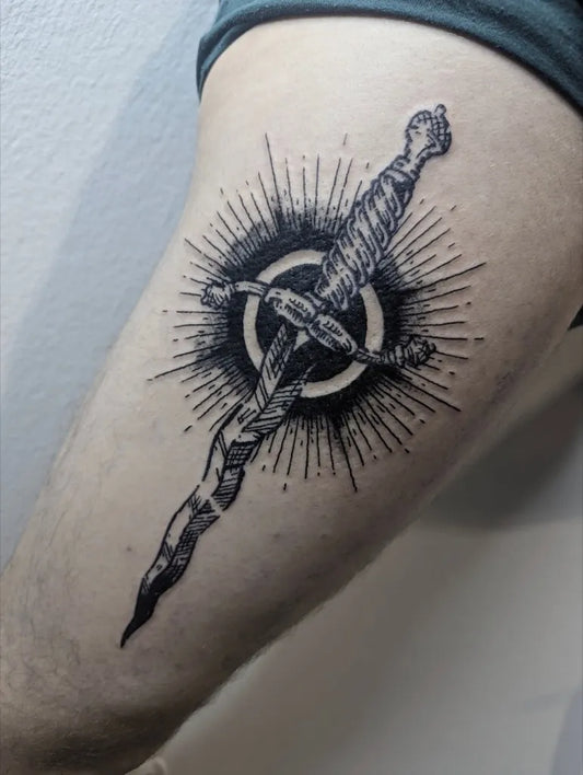 Medium Woodcut Dagger and Sunburst Tattoo on Men Arm by @_loth.art_