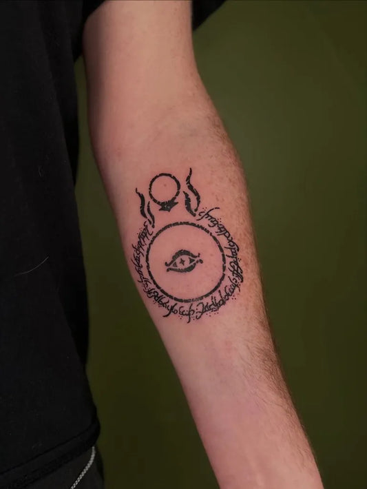 Medium Woodcut Eye in Circle Tattoo on Men Arm by @tapiotats
