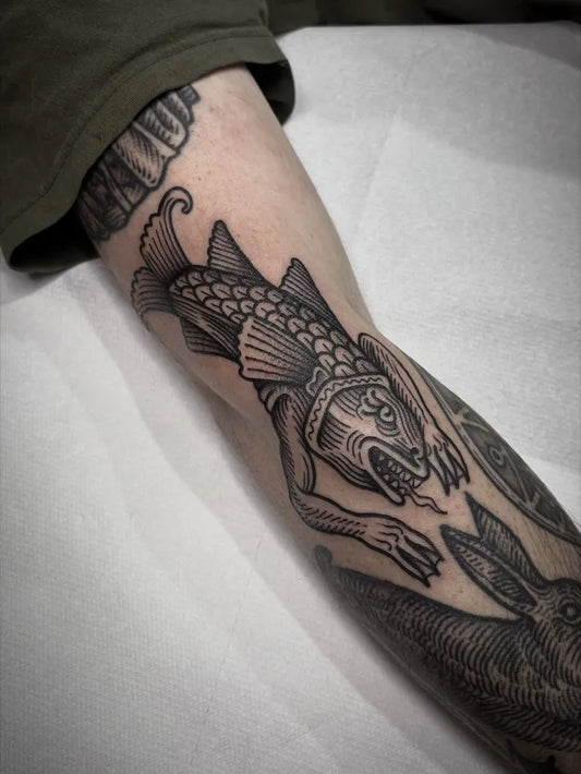 Medium Woodcut Fantastical Fish Tattoo on Men Arm by @connorkingrat
