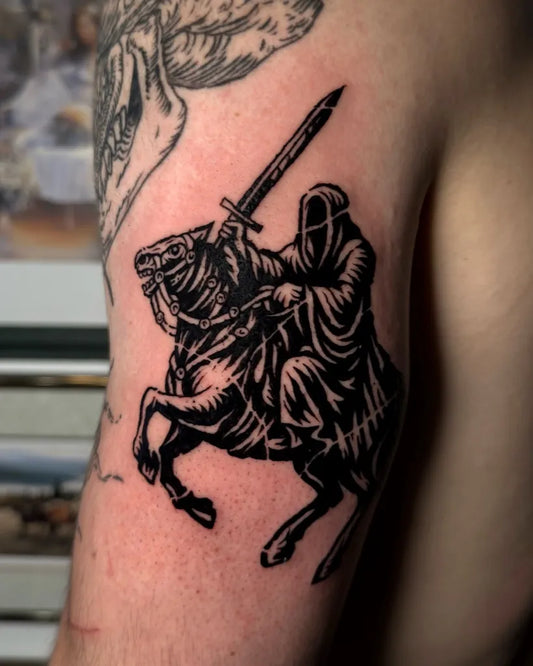 Medium Woodcut HoodedRiderOnHorseWithSword Tattoo on Men Arm by @kenziecooperart