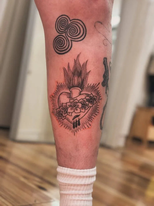 Medium Woodcut Sacred Heart Flaming Roses Tattoo on Women Thigh by @parliament.house