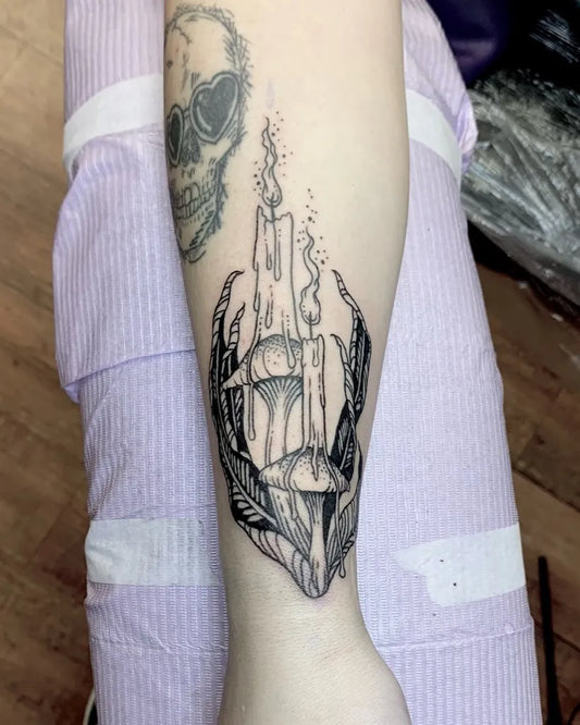 Medium Woodcut Skull Candle Mushroom Tattoo on Women Arm by @miss.rage.tattoos
