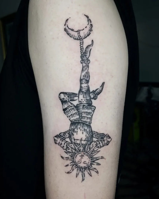 Medium Woodcut The Hanged Man Tarot Card Tattoo on Men Arm by @tattooed.bytiny