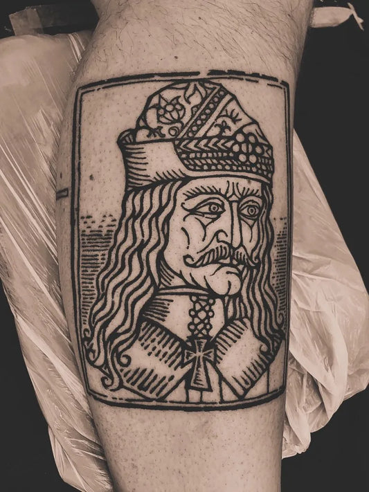 Medium Woodcut Vlad Tepes Portrait Tattoo on Men Leg by @markofcaintattoo