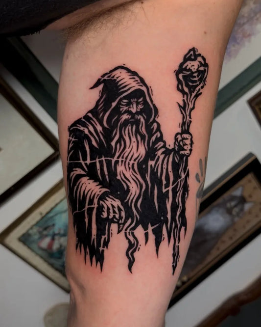 Medium Woodcut Wizard with Staff Tattoo on Men Arm by @kenziecooperart