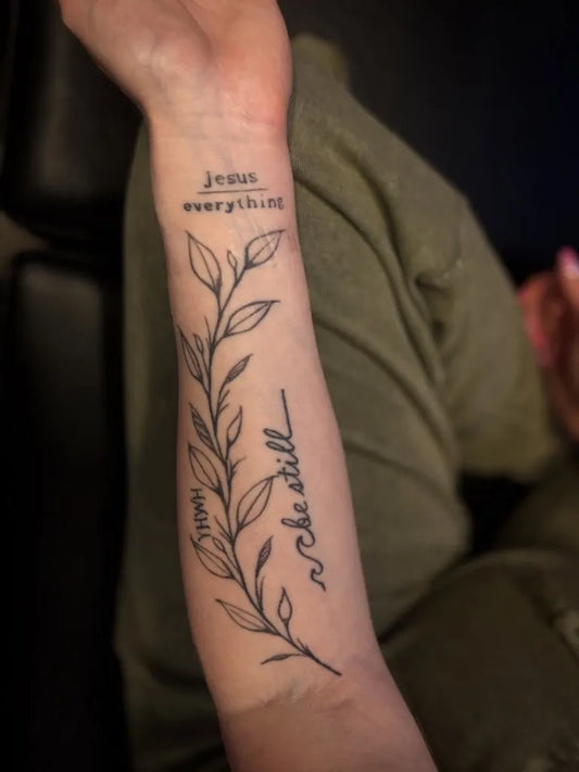 Medium Word with Leaves Forearm on Women Arm Tattoo by @leartistry_ink