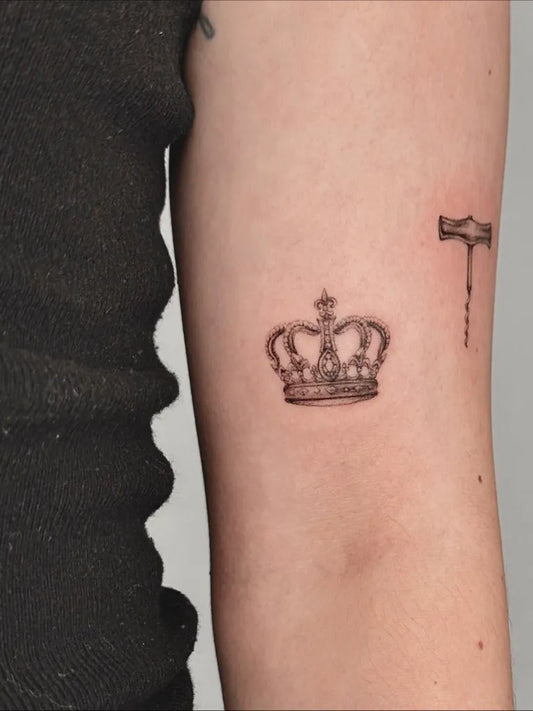 Micro Realism Crown and Hammer Tattoo on Women Arm by @onebyonetattoo