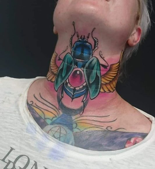 Neo Traditional Beetle Throat Tattoo on Women by @neckandthroat_tattoos