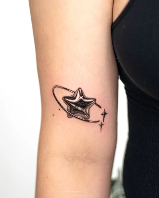 Small 3D Orbiting Star Tattoo on Women Arm by @zero_ink_