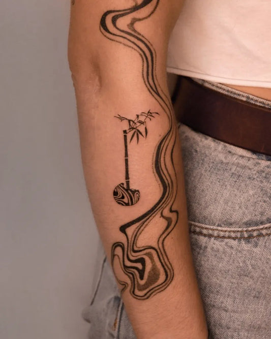 Small Abstract Bamboo and Waves Tattoo on Women Arm by @you.tats