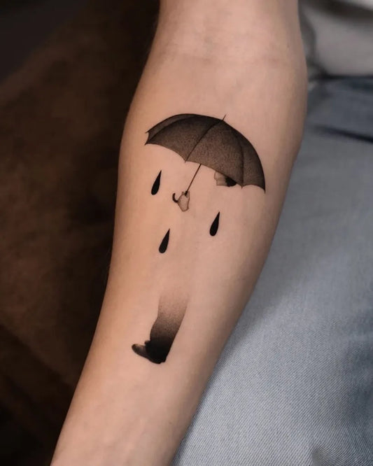 Small Abstract Umbrella with Rain and Shoe Women Forearm by @surrealismtattoo