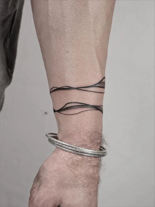 Small Abstract Wavy Lines Tattoo on Men Wrist by @chrilletattoo