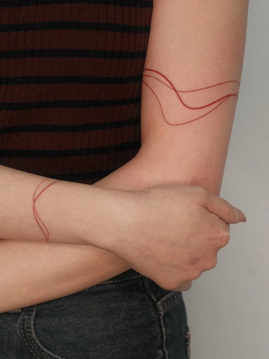 Small Abstract Wavy Lines Tattoo on Women Arm by @sokolova_art