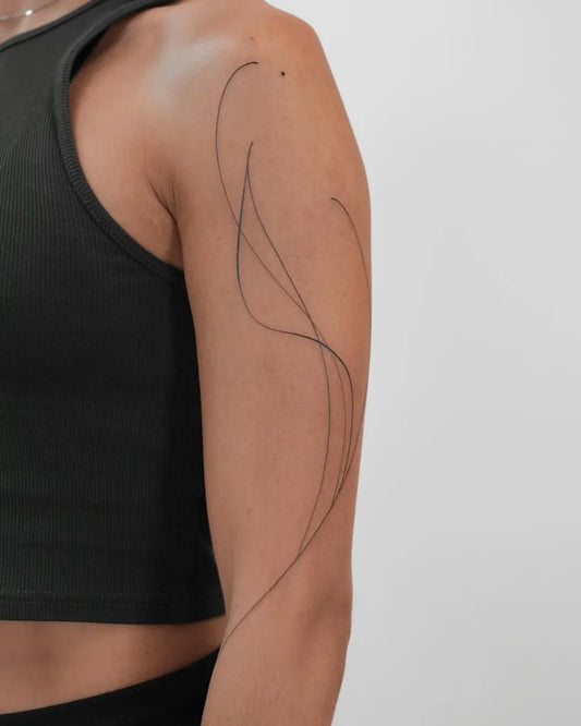 Small Abstract Wavy Lines Tattoo on Women Shoulder by @estefaniapinell
