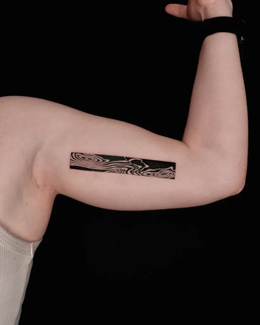 Small Abstract Wavy Stripe Tattoo on Women Upper Arm by @you.tats