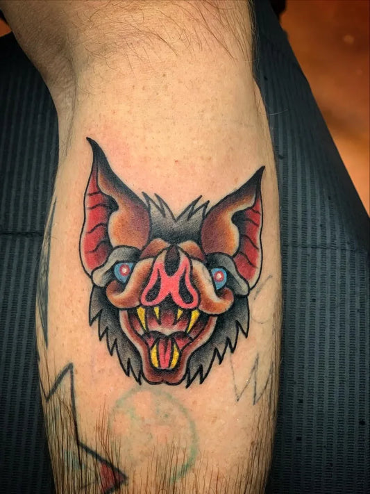 Small American Traditional Bat Halloween Tattoo on Men Knee by @dzeone