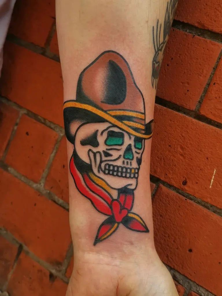 Small American Traditional Cowboy Skull with Bandana on Men Wrist Tattoo by @mikewalestattoo