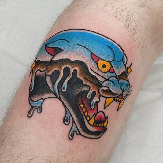 Small American Traditional Dripping Blue Panther Head on Men Arm Tattoo by @harriethopetattoos