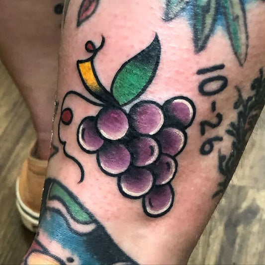 Small American Traditional Grapes on Women Leg Tattoo by @tuffluckkevin