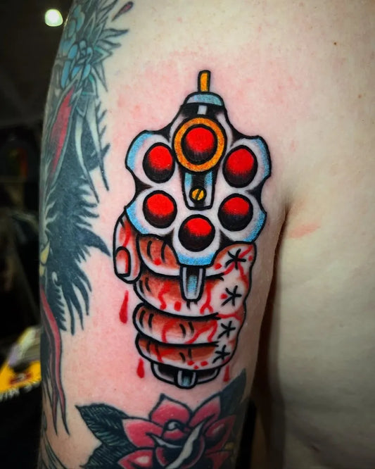 Small American Traditional Handgun Drips of Blood on Men Arm Tattoo by @snakelicausi