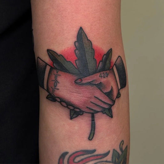 Small American Traditional Handshakes Maple Leaf on Women Arm Tattoo by @meifangtattoo