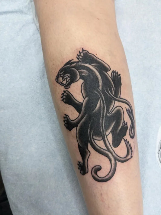 Small American Traditional Panther on Women Arm Tattoo by @rymar_tattoos