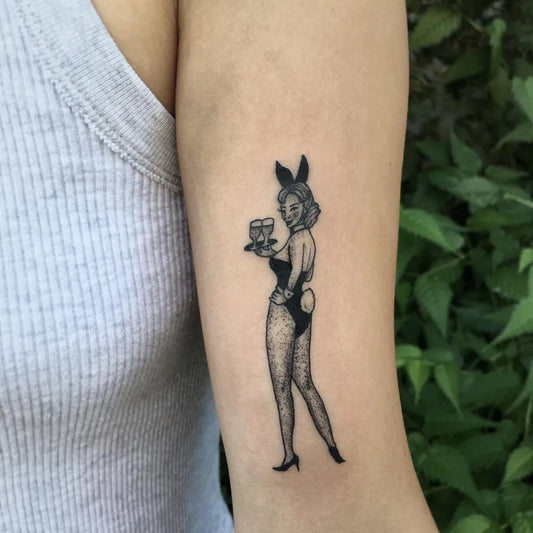 Small American Traditional Pin Up Girl Tattoo on Women Arm by @naleak_tattoo