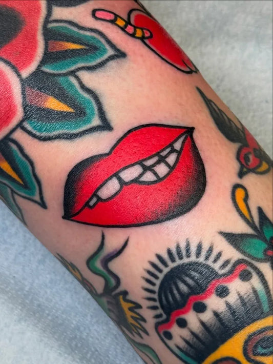 Small American Traditional Red Lips Rose Swallow on Women Arm Tattoo by @j.millstattoos