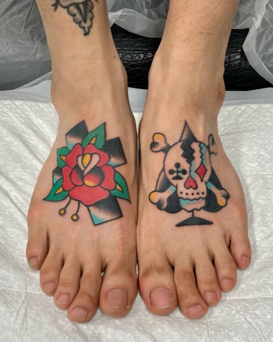 Small American Traditional Rose and Skull on Men Feet Tattoo by @seokgu.tattooer