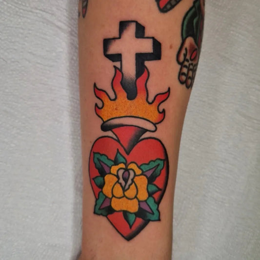 Small American Traditional Sacred Heart with Flames and Crown on Men Arm Tattoo by @kanada_tattooer