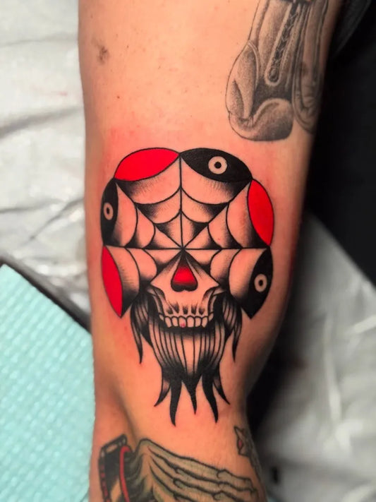 Small American Traditional Spider Web Skull with Eyes on Men Arm Tattoo by @levivasqueztattoo