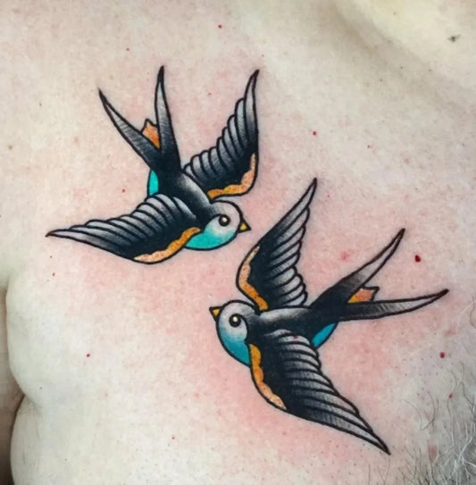 Small American Traditional Swallows on Men Chest Tattoo by @12ozstudios